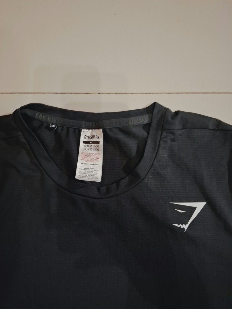 Gymshark drifit shirt (Category: Activewear) located in Narvacan. Submitted by jigger85 (Listing ID 1470083893, Image 2). Description: gymshark drifit shirt like new no issue color dark gray 9.7 condition size: xl on tag dimes: 21 x 29 can fit to medium to large.