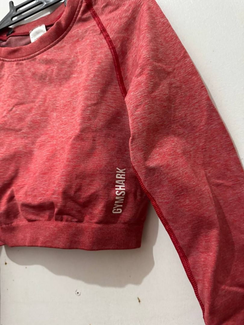 Gymshark Red Marled Long Sleeve Crop Top (Category: Longsleeves) located in Santa Rosa. Submitted by sherikasstuff (Listing ID 1469957740, Image 3). Description: - Color/Fabric: Reddish pink marled - Condition: Used only once/Excelllent - Size: S but can fit XS-S - Material: 64% polyamide, 29% polyester, 7% elastane - Features: Round neck, raglan sleeves, printed white logo near hem - Perfect for: Workout sessions, gym, aerial silk/hammock/hoop, 