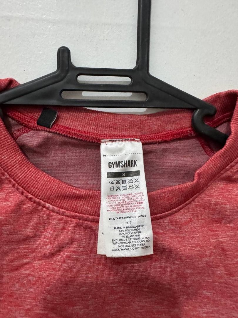 Gymshark Red Marled Long Sleeve Crop Top (Category: Longsleeves) located in Santa Rosa. Submitted by sherikasstuff (Listing ID 1469957740, Image 2). Description: - Color/Fabric: Reddish pink marled - Condition: Used only once/Excelllent - Size: S but can fit XS-S - Material: 64% polyamide, 29% polyester, 7% elastane - Features: Round neck, raglan sleeves, printed white logo near hem - Perfect for: Workout sessions, gym, aerial silk/hammock/hoop, 