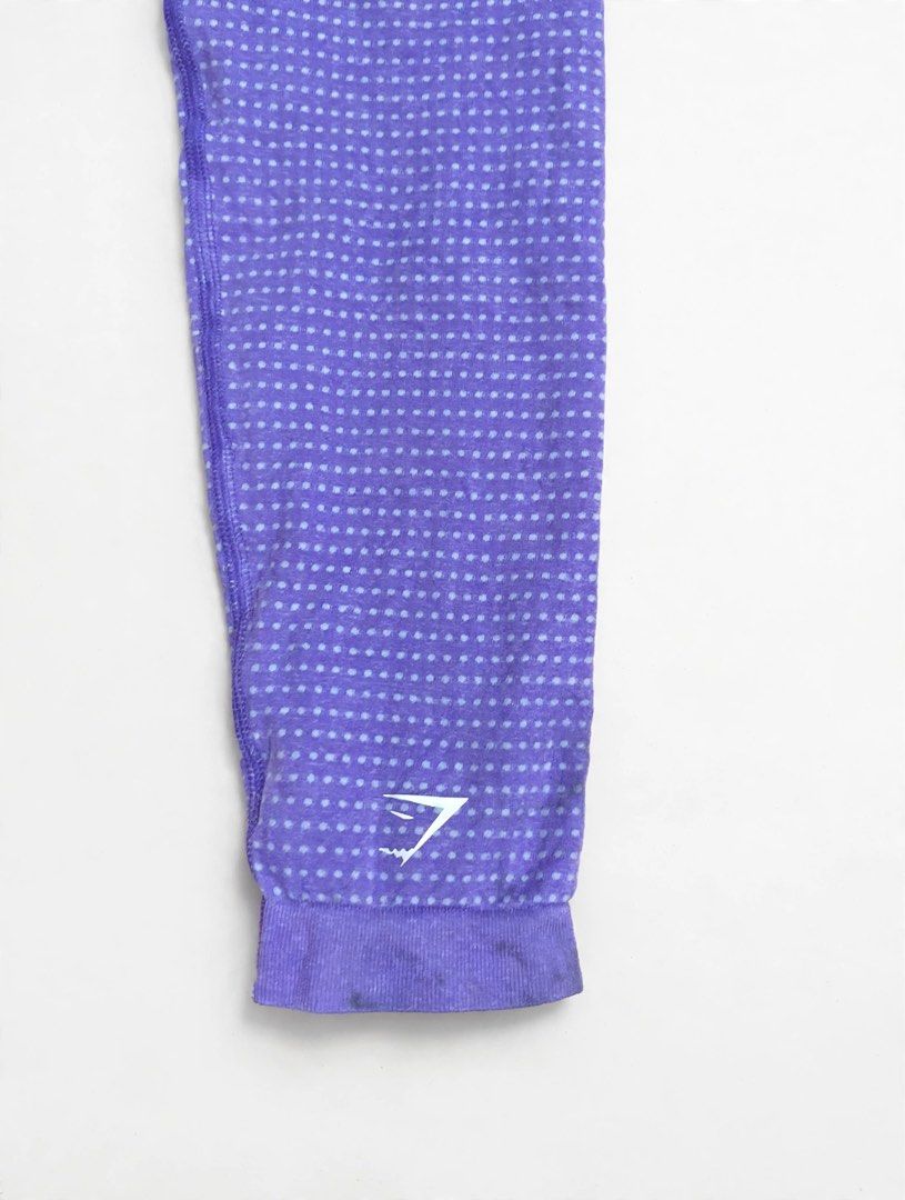 Gymshark Seamless Leggings Purple Medium (Category: Activewear) located in Las Pinas. Submitted by john.ross.sayoc.30-82096 (Listing ID 1470071135, Image 3). Description: - Brand: Gymshark - Style: Seamless leggings with dot pattern detailing - Color: Purple - Size: Medium - Fit: High-waisted - Details: White printed logo on hip and lower leg - Material: 93% nylon, 7% elastane - Origin: Made in Jordan - Condition: Great for gym, yoga, or everyday