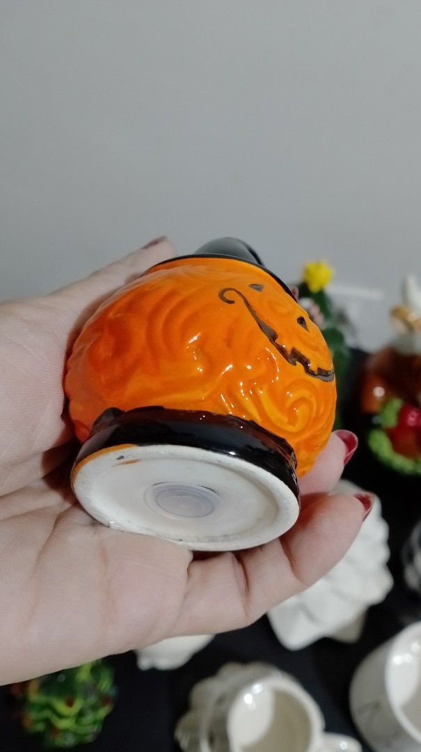 Halloween Pumpkin with Witch Hat Salt and Pepper Shaker (Category: Pitchers & Dispensers) located in San Pablo. Submitted by elijasam (Listing ID 1470132536, Image 2). Description: - Adorable ceramic pumpkin shaker wearing a classic black witch hat - Beautiful textured swirl pattern on the vibrant orange body - Hand-painted smiling jack-o-lantern face on the front - Functional dispensing holes neatly placed at the top of the hat - Comes with a se