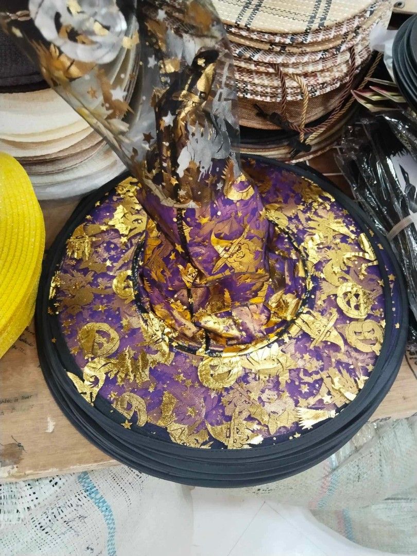 Halloween witch hat costume accessory (Category: Caps & Hats) located in Manila. Submitted by neojamesca55018 (Listing ID 1470002085, Image 2). Description: - Pointy Halloween party hat with a wide brim - Decorated with fun pumpkins, bats, and metallic foil prints - Lightweight fabric for comfortable all-day wear - Ideal for trick-or-treating, costume parties, and spooky events.