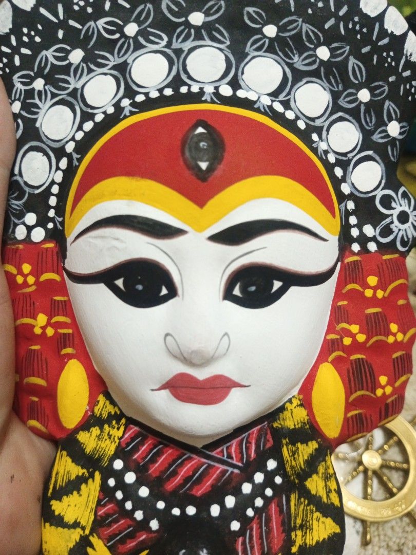 Handpainted traditional decorative wall mask (Category: Wall Decor) located in Manila. Submitted by christalyn94263 (Listing ID 1470123640, Image 2). Description: - Handpainted traditional decorative wall mask - Vibrant red, yellow, black, and white colors - Intricate details on the headdress, facial features, and collar - Lightweight with a hollow back - Includes an attached string for easy hanging - Perfect for cultural decor and wall displays 
