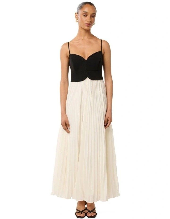 Hartford Pleated Midi Dress (Category: Dresses) located in Manila. Submitted by nootyoursss (Listing ID 1470056587, Image 1). Description: FOR RENT | Hartford Pleated Midi Dress – Black/White Make a statement with this elegant Hartford Pleated Midi Dress, featuring a structured black sweetheart bodice, delicate spaghetti straps, and a flowy white pleated skirt. Perfect for formal events, weddings, dinners, and special occasions. DRESS DETAILS • B