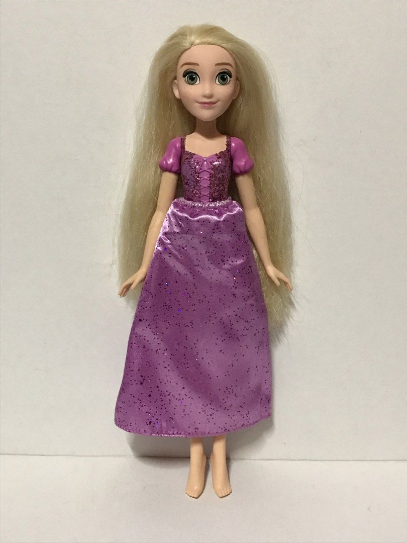 Hasbro Disney Princess Rapunzel Doll (Category: Kids Toys) located in Manila. Submitted by iyasellsph (Listing ID 1469992066, Image 2). Description: Hasbro Disney Princess Rapunzel Doll Approx 11 inches tall Conservatively classified as Lightly Used; Looks new, save for optional reglittering on front of bodice Molded top; satin skirt with micro crystals Very clean doll and skirt Clean, soft luxurious long blonde hair with layered ends Very tight 