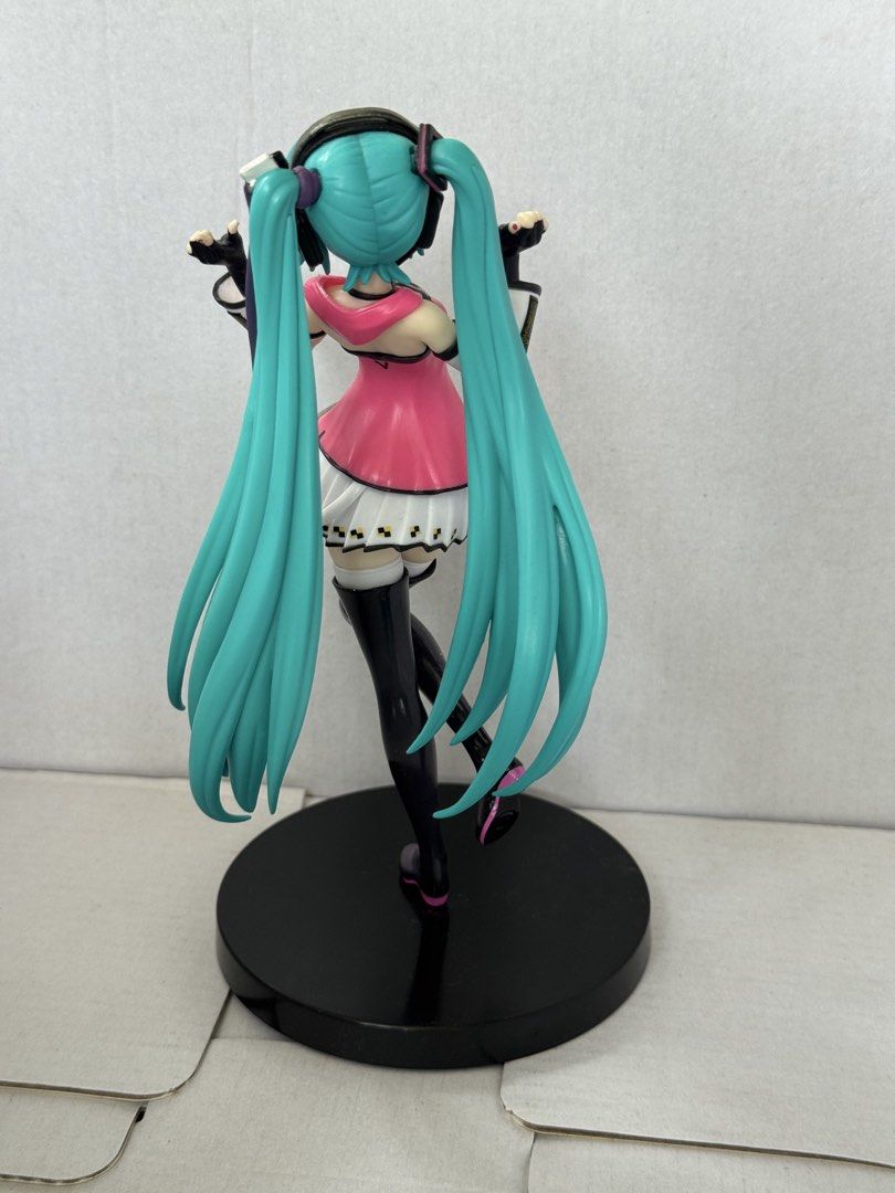Hatsune Miku Project Diva Arcade Future Tone SPM Figure (Category: Figurines & Statues) located in President Roxas. Submitted by isserminator (Listing ID 1469955930, Image 2). Description: - Authentic Hatsune Miku Sega SPM figure from Project Diva Arcade Future Tone - Vibrant turquoise twin tails, pink/orange gradient top, and white checkered skirt - Includes original black circular base - Condition note: One peg broke inside the foot slot, and t