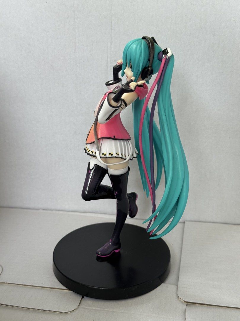 Hatsune Miku Project Diva Arcade Future Tone SPM Figure (Category: Figurines & Statues) located in President Roxas. Submitted by isserminator (Listing ID 1469955930, Image 3). Description: - Authentic Hatsune Miku Sega SPM figure from Project Diva Arcade Future Tone - Vibrant turquoise twin tails, pink/orange gradient top, and white checkered skirt - Includes original black circular base - Condition note: One peg broke inside the foot slot, and t
