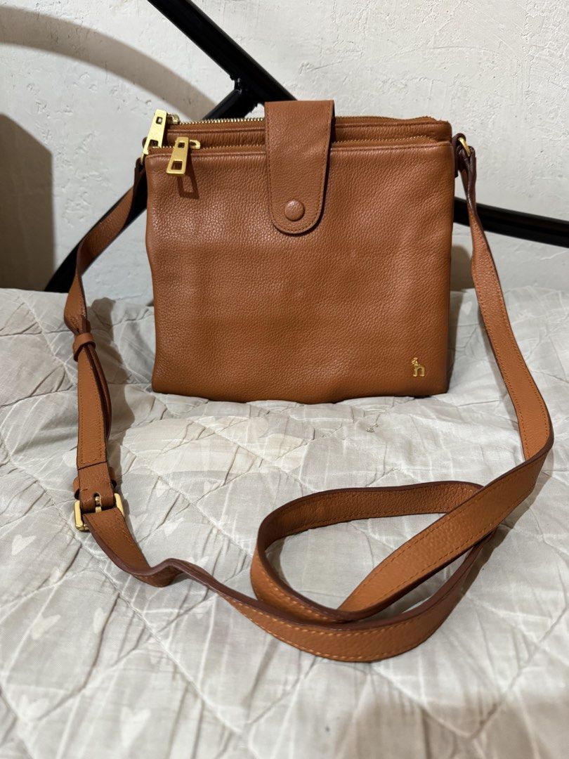 Hazzys sling bag (Category: Cross-body Bags) located in Danao, Cebu. Submitted by jojie.1983 (Listing ID 1470014955, Image 1). Description: - original hazzys genuine leather - sling bag -excellent condition -small size -color brown with gold hardware.