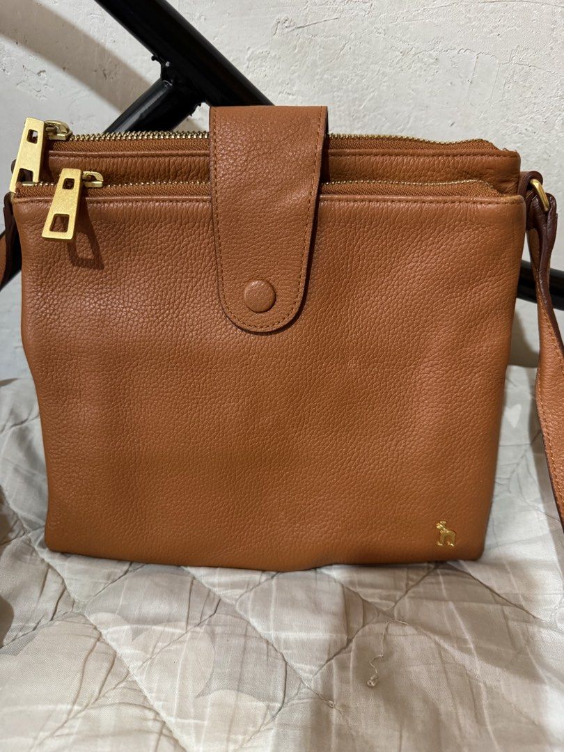 Hazzys sling bag (Category: Cross-body Bags) located in Danao, Cebu. Submitted by jojie.1983 (Listing ID 1470014955, Image 2). Description: - original hazzys genuine leather - sling bag -excellent condition -small size -color brown with gold hardware.