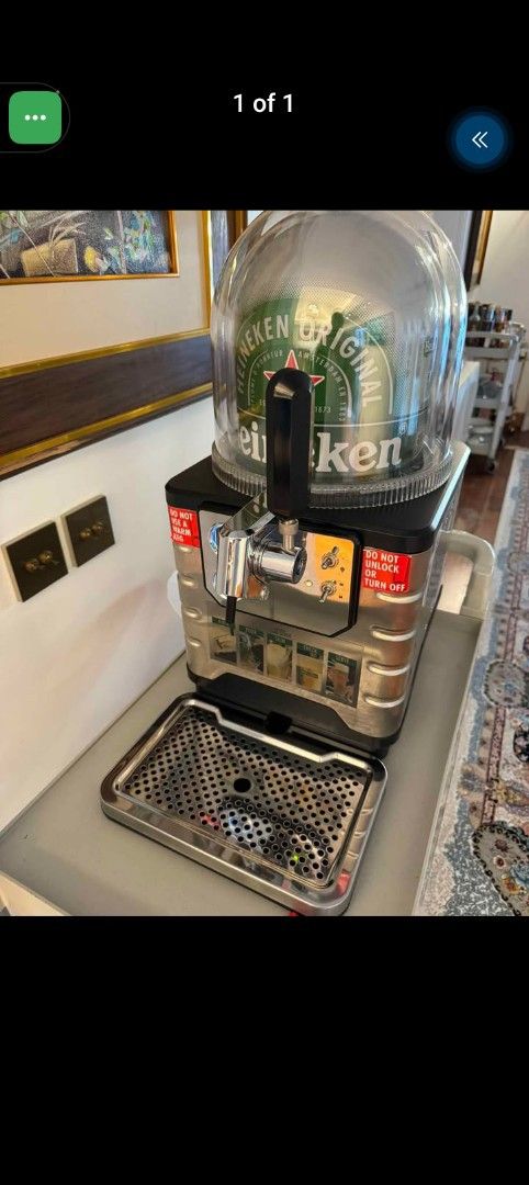Heineken Blade Draft Beer Dispenser Machine (Category: Pitchers & Dispensers) located in Manila. Submitted by johnpauldr95292 (Listing ID 1470026953, Image 2). Description: - Heineken Blade draft beer machine, perfect for home bars and parties - Dispenses fresh draught beer using the proprietary Blade keg system - Stylish chrome finish tap handle and stainless steel drip tray - Clear dome cover on top showcasing the iconic green Heineken keg insi