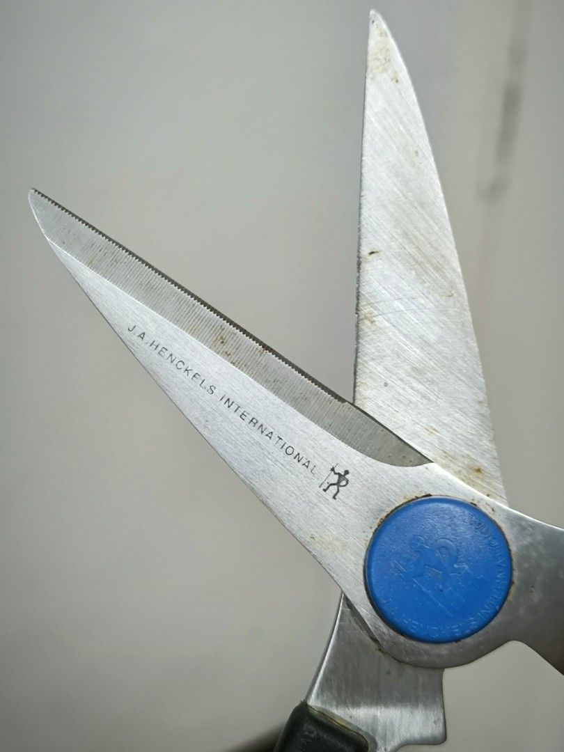 Henckels (Zwilling) Multi-Purpose Heavy-Duty Kitchen Shears / Scissors (Category: Knives & Chopping Boards) located in Angeles City. Submitted by yellowbrickstore (Listing ID 1470116179, Image 3). Description: Brand: Henckels / J.A. Henckels (Zwilling Group) ​Single Halberdman Logo: Features the official Henckels logo printed on the blade and blue pivot cap. ​Blade Material: High-carbon stainless steel micro-serrated blades for non-slip cutting. 