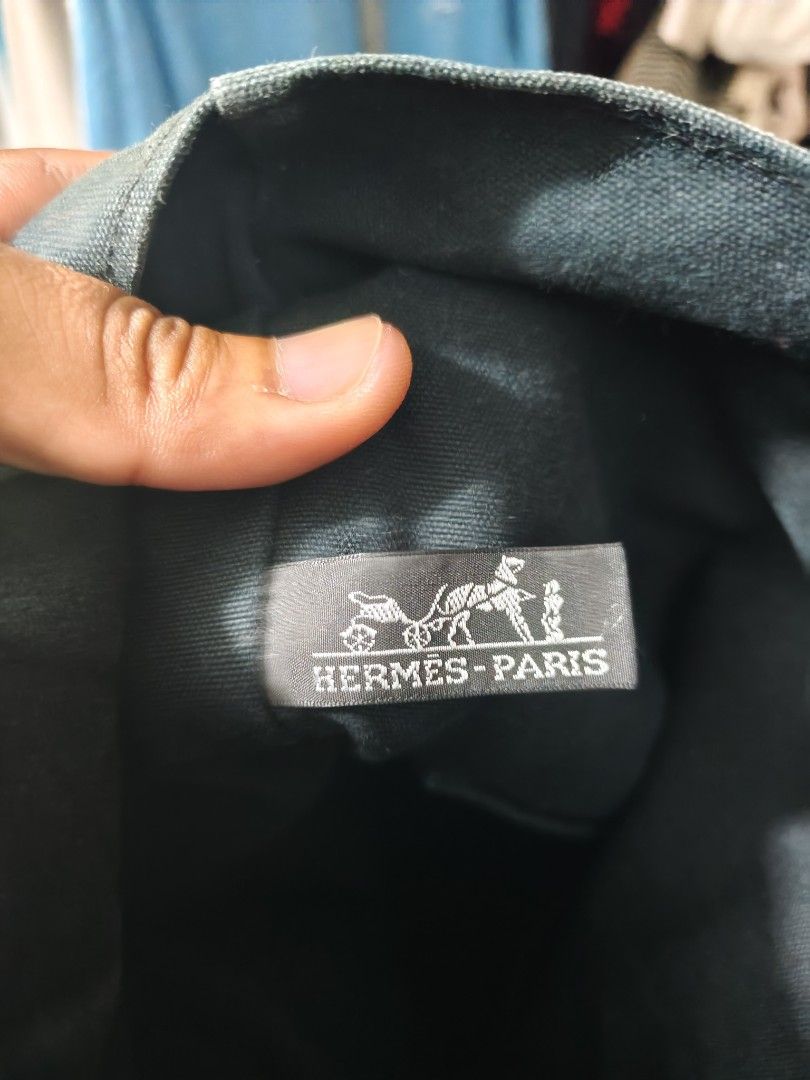 Hermes Paris Canvas Tote Bag (Category: Tote Bags) located in Isulan. Submitted by jaysthrift (Listing ID 1470027264, Image 3). Description: - Brand: Hermes Paris - Color: Dark Green with matching front stripe accents - Material: 100% Cotton Canvas (Made in France) - Design: Open top with a spacious, roomy interior - Handles: Double structured handles for comfortable carrying - Care Instructions: Dry clean only - Condition: Excellent / Well-maint