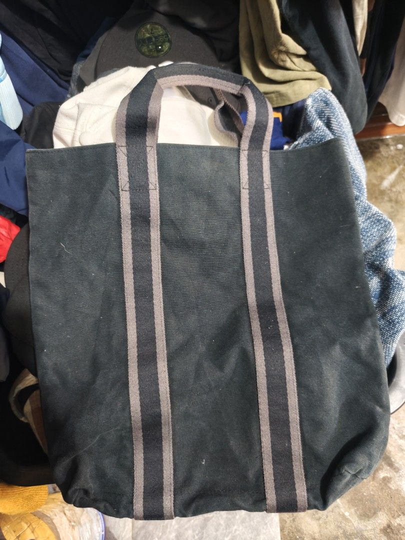 Hermes Paris Canvas Tote Bag (Category: Tote Bags) located in Isulan. Submitted by jaysthrift (Listing ID 1470027264, Image 2). Description: - Brand: Hermes Paris - Color: Dark Green with matching front stripe accents - Material: 100% Cotton Canvas (Made in France) - Design: Open top with a spacious, roomy interior - Handles: Double structured handles for comfortable carrying - Care Instructions: Dry clean only - Condition: Excellent / Well-maint