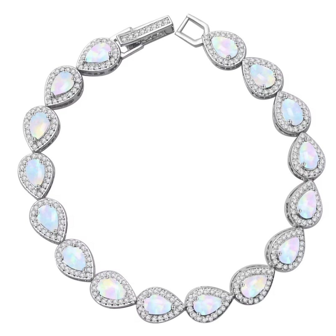 High quality Opal silver plated (Category: Bracelets) located in Manila. Submitted by hackelina (Listing ID 1470074928, Image 1). Description: - Material: Clean silver-finish metal - Stones: Teardrop synthetic opals surrounded by sparkling clear rhinestones - Closure: Secure box clasp - Fit: Standard wrist size - Style: Elegant, iridescent piece perfect for dressing up any outfit.