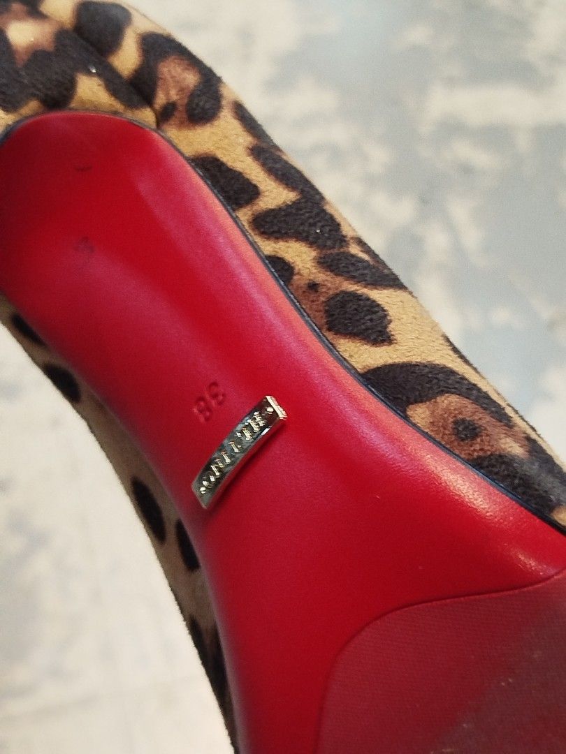 Hltino Leopard Print High Heels Size 38 (Category: Heels) located in Quezon City. Submitted by cuteitemsonlyyy (Listing ID 1469998802, Image 3). Description: - Brand: Hltino - Style: Leopard print stiletto pumps with classic red soles and pointed toe - Size: 38 (marked on sole with gold-tone brand badge) - Material: Patterned calf hair upper - Interior: Clean inner lining with stamped logo - Origin: Made in China - Condition: Excellent, ready to 