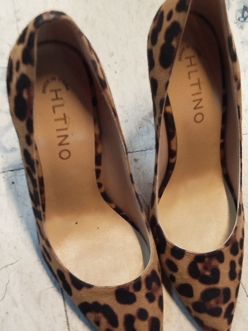 Hltino Leopard Print High Heels Size 38 (Category: Heels) located in Quezon City. Submitted by cuteitemsonlyyy (Listing ID 1469998802, Image 2). Description: - Brand: Hltino - Style: Leopard print stiletto pumps with classic red soles and pointed toe - Size: 38 (marked on sole with gold-tone brand badge) - Material: Patterned calf hair upper - Interior: Clean inner lining with stamped logo - Origin: Made in China - Condition: Excellent, ready to 