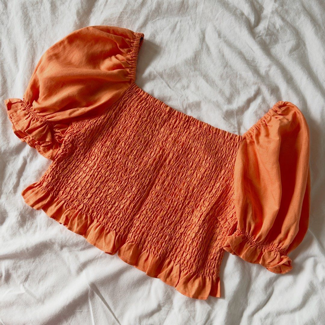 H&M - Tangerine Puff Sleeve Top (Category: Others Tops) located in Makati City. Submitted by uniquefindsonly.ph (Listing ID 1470019731, Image 1). Description: 📍Makati Brand: H&M Size on tag: Small Fits small-medium No flaws.
