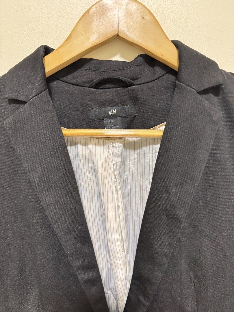 H&M Black Suit Blazer (Category: Coats, Jackets and Outerwear) located in Manila. Submitted by seayouncey (Listing ID 1470055256, Image 3). Description: Size length 24 inchs shoulder bask 16 inchs - Brand: H&M - Size: EUR 36 / US 6 / CN 165/84A - Color: Classic black with stylish white & grey striped inner lining - Fit: Slim fit with structured shoulders - Details: Single-button front closure, functional flap pockets on both sides - Condition: Gr