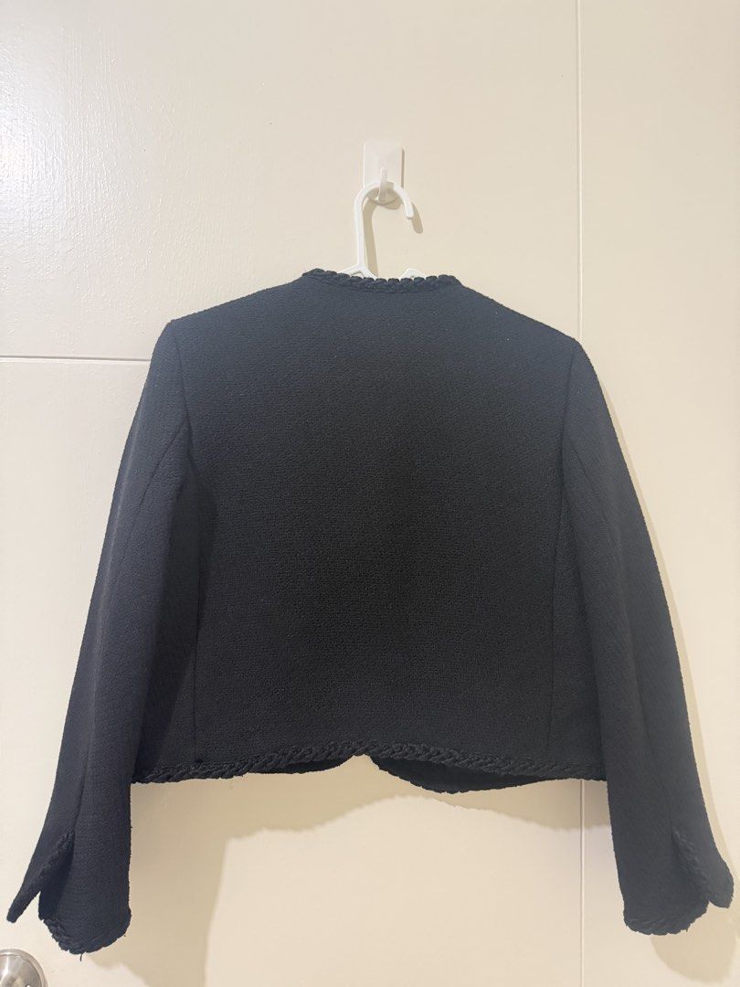 H&M Black Tweed Jacket with Gold Buttons (Category: Coats, Jackets and Outerwear) located in Pasay City. Submitted by triciasclosetph (Listing ID 1470066119, Image 2). Description: - Brand: H&M - Style: Black tweed jacket with open front and gold button accents - Details: Elegant braided trim on neckline, placket, hem, and pockets - Features: Two front pockets, structured shoulders, and clean interior lining - Fit & Pairing: Timeless and versatil