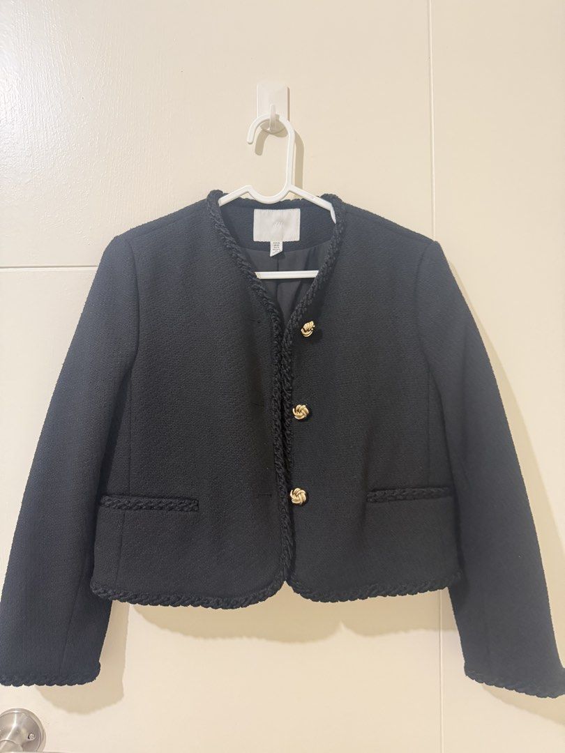 H&M Black Tweed Jacket with Gold Buttons (Category: Coats, Jackets and Outerwear) located in Pasay City. Submitted by triciasclosetph (Listing ID 1470066119, Image 1). Description: - Brand: H&M - Style: Black tweed jacket with open front and gold button accents - Details: Elegant braided trim on neckline, placket, hem, and pockets - Features: Two front pockets, structured shoulders, and clean interior lining - Fit & Pairing: Timeless and versatil