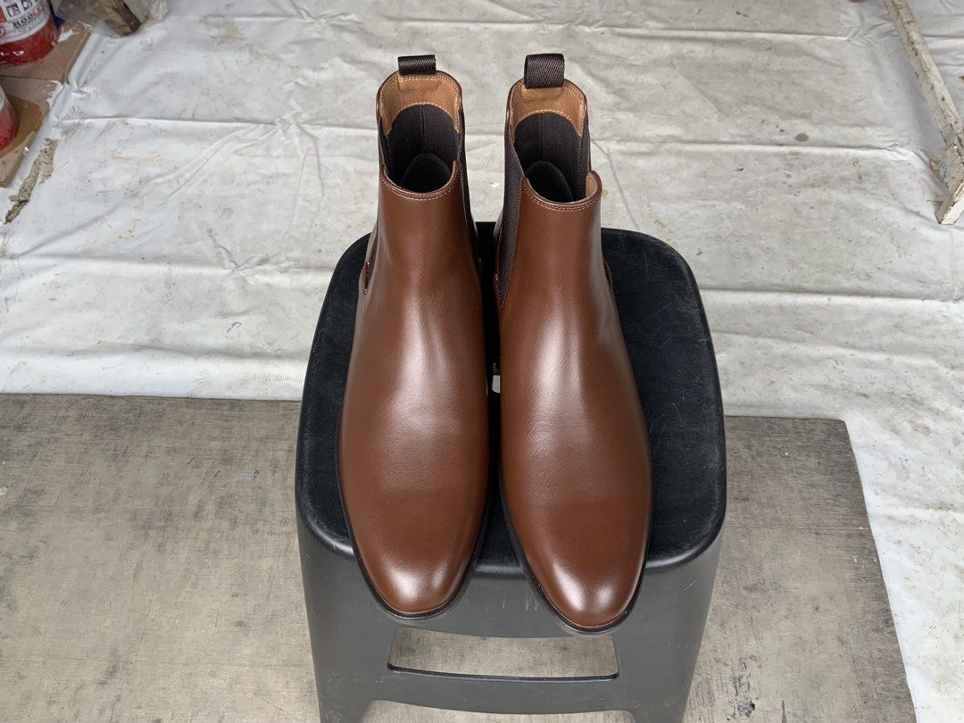 H&M Brown Chelsea Boots (Category: Boots) located in Makati City. Submitted by imagineinc. (Listing ID 1469995973, Image 1). Description: - Brown Chelsea boots - Size US 11.5 - Purchased online, wrong size, too big - Brand new, never worn, pristine condition - Features Elastic side gussets and heel pull tabs for easy slip-on - Clean, smooth finish across the toes.