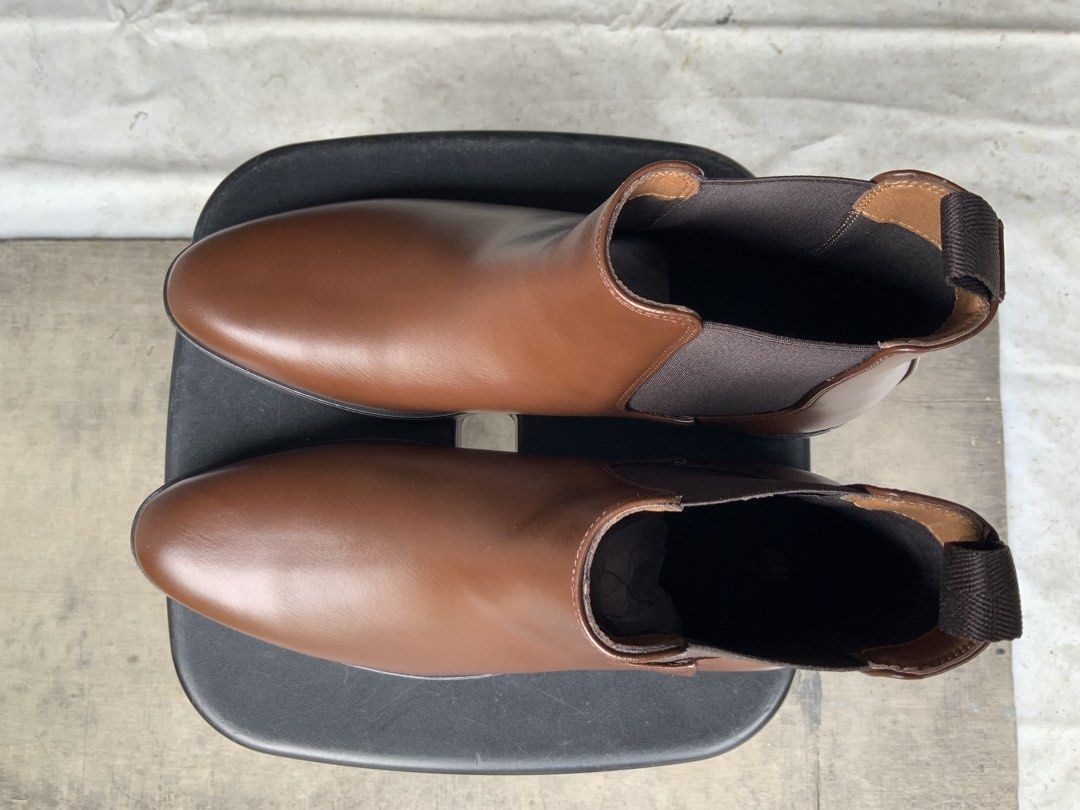 H&M Brown Chelsea Boots (Category: Boots) located in Makati City. Submitted by imagineinc. (Listing ID 1469995973, Image 3). Description: - Brown Chelsea boots - Size US 11.5 - Purchased online, wrong size, too big - Brand new, never worn, pristine condition - Features Elastic side gussets and heel pull tabs for easy slip-on - Clean, smooth finish across the toes.