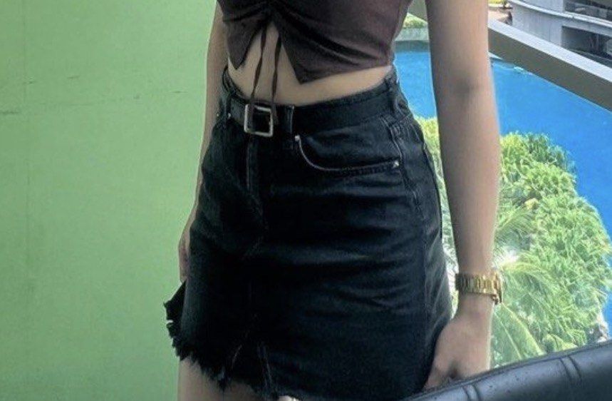 H&M Dark Grey Denim Skirt (Category: Skirts) located in Makati City. Submitted by anglvlln (Listing ID 1470128540, Image 2). Description: - Color/Wash: Dark grey wash - Fit: High-waisted - Details: Raw fringe hem, front button and zip closure, belt loops - Pockets: Classic five-pocket styling plus back patch pockets - Measurements: 13 inches across the waist, 15 inches in length - Condition: Worn once, still in great shape - Styling: Perfect to p