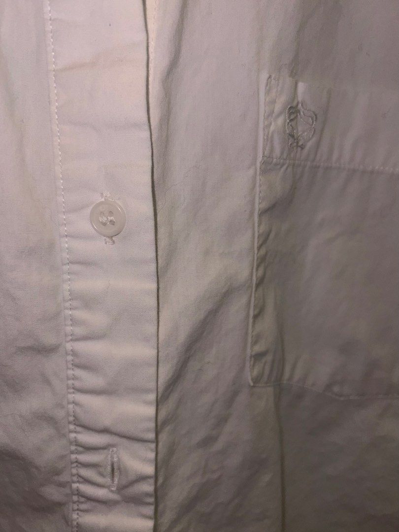 H&M Divided White Button-Down Shirt (Category: Shirts) located in Makati City. Submitted by chloudyday (Listing ID 1470064481, Image 3). Description: H&M Divided, Size S (but can fit M), Relaxed Fit Issue (Last Photo): Barely noticeable yellow stain near the button area..