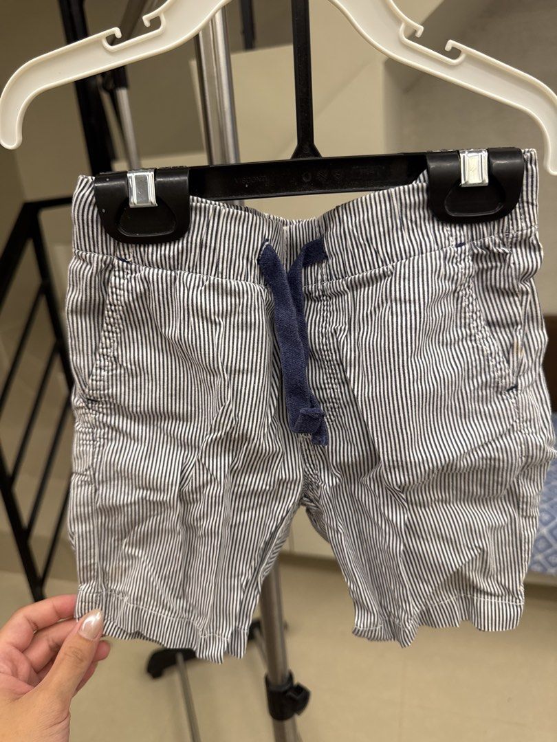 H&M Striped Shorts Boys Size 2-3Y (Category: Babies & Kids Fashion) located in Manila. Submitted by __nix (Listing ID 1470017846, Image 1). Description: - Brand: H&M - Size: EUR 98 / US 2-3T - Design: Navy blue and white vertical stripes - Comfort: Elastic waistband with dark blue drawstring for easy adjustment - Pockets: Two front pockets - Fabric: Lightweight and easy to pull on for daily wear.