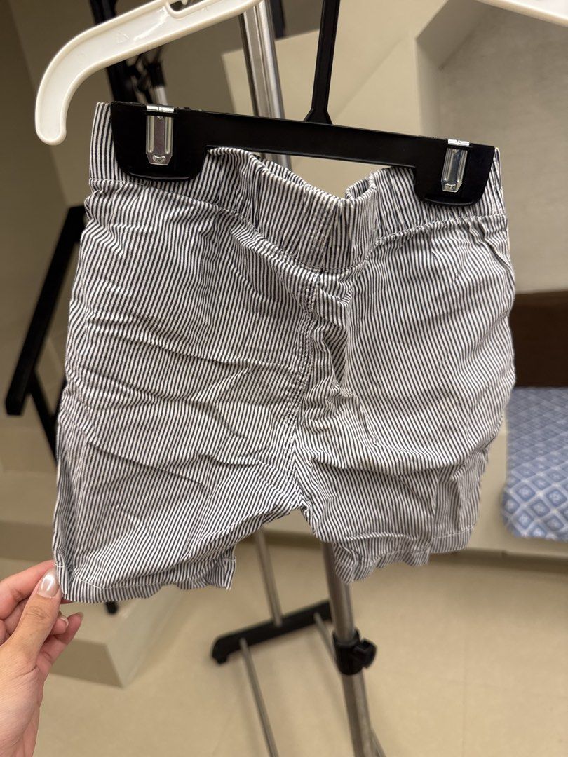 H&M Striped Shorts Boys Size 2-3Y (Category: Babies & Kids Fashion) located in Manila. Submitted by __nix (Listing ID 1470017846, Image 2). Description: - Brand: H&M - Size: EUR 98 / US 2-3T - Design: Navy blue and white vertical stripes - Comfort: Elastic waistband with dark blue drawstring for easy adjustment - Pockets: Two front pockets - Fabric: Lightweight and easy to pull on for daily wear.