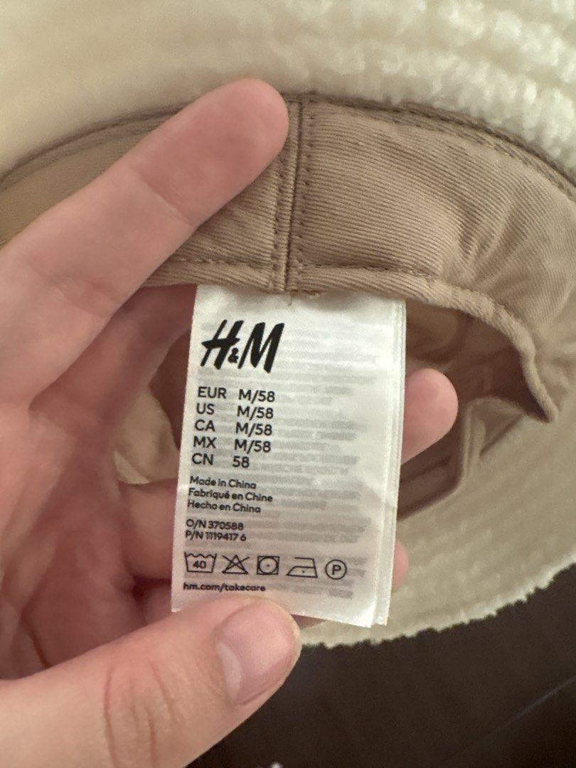 H&M White Sherpa Bucket Hat (Category: Hats & Beanies) located in Dasmarinas. Submitted by littleczarmer (Listing ID 1469977407, Image 3). Description: - Brand: H&M - Material: Fluffy white sherpa with beige lining - Size: M (fits 58 cm head circumference) - Features: Warm, cozy, and stylish - Condition: Great casual accessory for cold weather - Origin: Made in China.