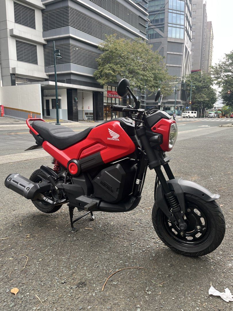 Honda Navi Motorcycle Scooter Red (Category: Motorbikes for Sale) located in Manila. Submitted by yurimahboy (Listing ID 1470019104, Image 2). Description: Honda Navi 2026 Complete papers and original Also have 2 valid id’s and 3 specimen for the first owner Registered until 2028 w/ 2 original keys w/ Plate number Open Deed of Absolute No issue Alarm or NCAP Odometer 8,*** km Newly Change Oil Upgraded parts - RCB SHOCK - Digital Panel Gauge - Cus