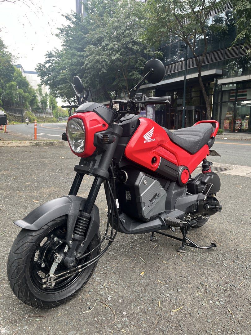 Honda Navi Motorcycle Scooter Red (Category: Motorbikes for Sale) located in Manila. Submitted by yurimahboy (Listing ID 1470019104, Image 1). Description: Honda Navi 2026 Complete papers and original Also have 2 valid id’s and 3 specimen for the first owner Registered until 2028 w/ 2 original keys w/ Plate number Open Deed of Absolute No issue Alarm or NCAP Odometer 8,*** km Newly Change Oil Upgraded parts - RCB SHOCK - Digital Panel Gauge - Cus