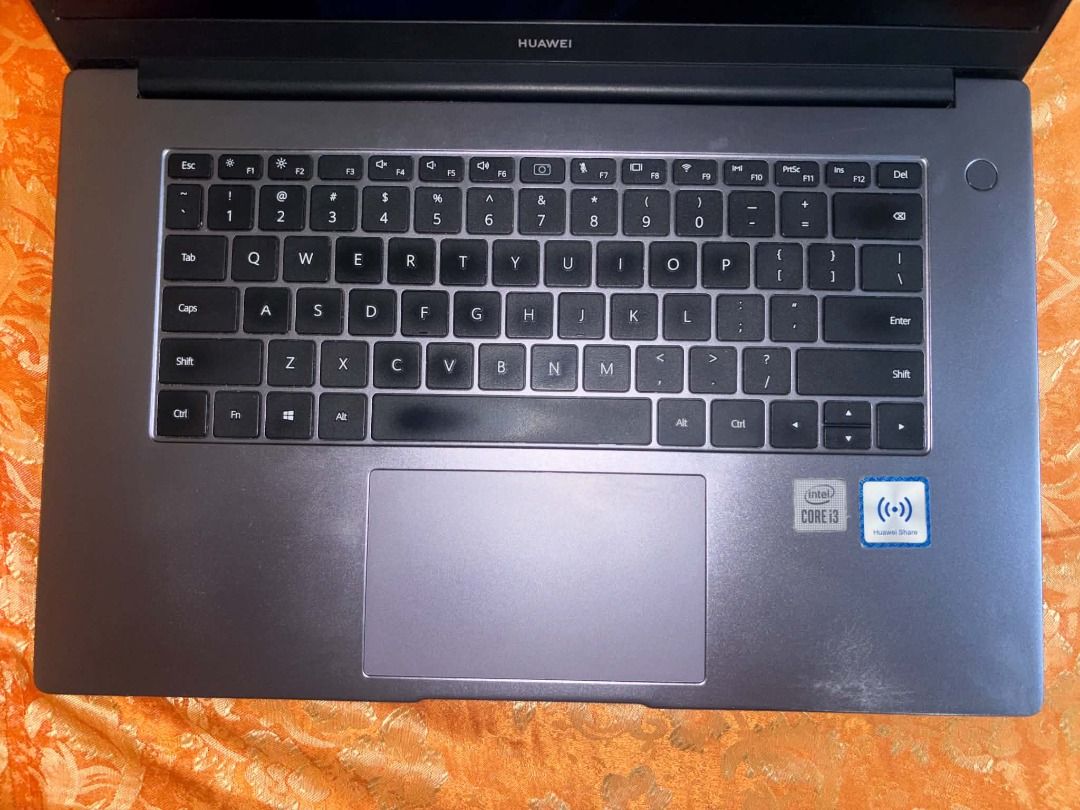 Huawei MateBook D15 Laptop (Category: Laptops & Notebooks) located in Caloocan City. Submitted by judynickcops (Listing ID 1470061019, Image 3). Description: - Color: Sleek Dark Grey - Processor: Intel Core i3 - Operating System: Windows OS - Keyboard: QWERTY layout with a spacious touchpad - Extra: Huawei Share sticker on the right palm rest - Condition: Fully operational display, keyboard, and overall hardware.