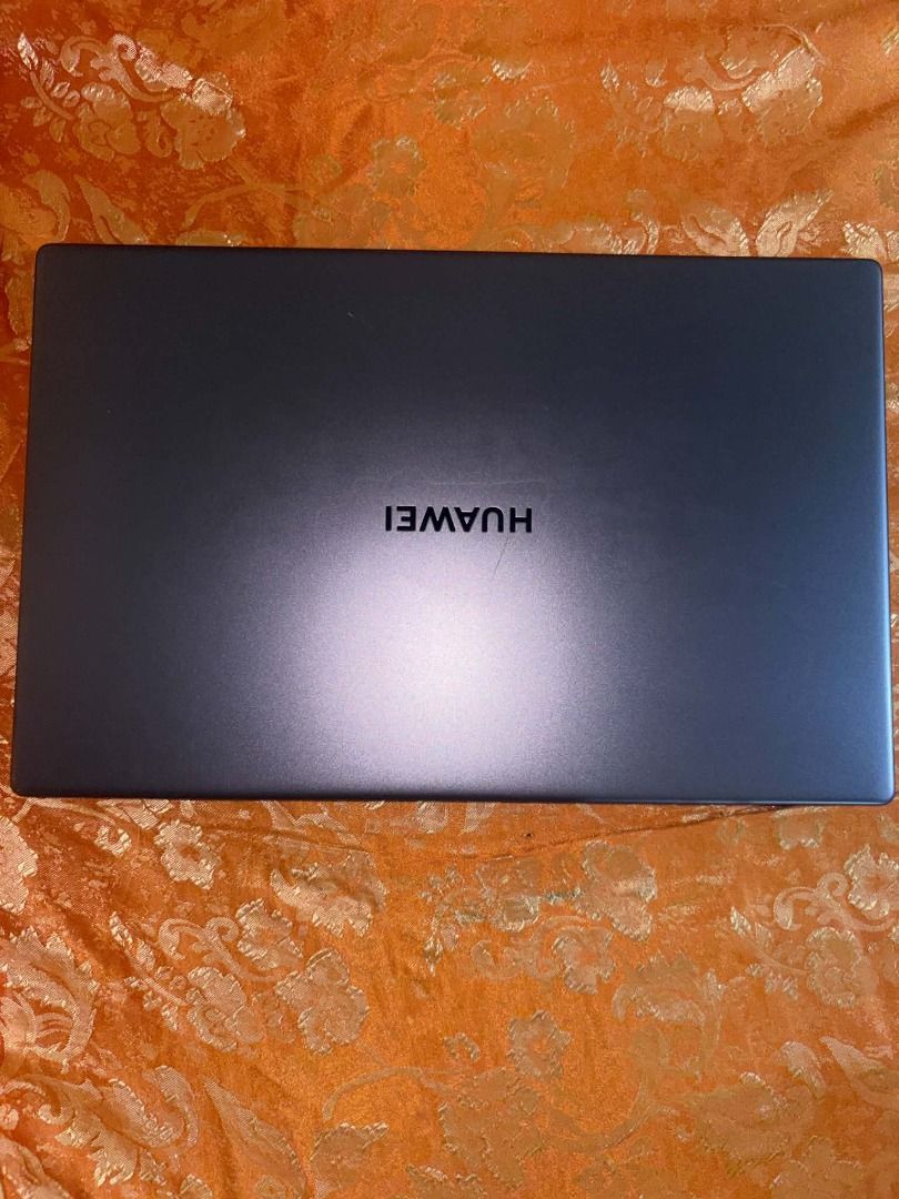 Huawei MateBook D15 Laptop (Category: Laptops & Notebooks) located in Caloocan City. Submitted by judynickcops (Listing ID 1470061019, Image 2). Description: - Color: Sleek Dark Grey - Processor: Intel Core i3 - Operating System: Windows OS - Keyboard: QWERTY layout with a spacious touchpad - Extra: Huawei Share sticker on the right palm rest - Condition: Fully operational display, keyboard, and overall hardware.