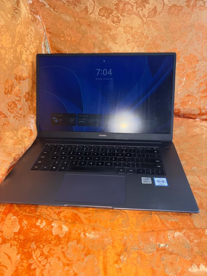 Huawei MateBook D15 Laptop (Category: Laptops & Notebooks) located in Caloocan City. Submitted by judynickcops (Listing ID 1470061019, Image 1). Description: - Color: Sleek Dark Grey - Processor: Intel Core i3 - Operating System: Windows OS - Keyboard: QWERTY layout with a spacious touchpad - Extra: Huawei Share sticker on the right palm rest - Condition: Fully operational display, keyboard, and overall hardware.