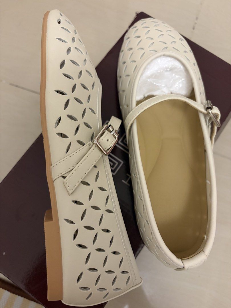 Hue Lily Creme Mary Jane Flats (Category: Flats & Sandals) located in Bacoor. Submitted by _camilleeee_ (Listing ID 1470084550, Image 2). Description: - Brand: Hue (Lily Creme flats) - Never Worn - Color & Material: Cream premium vegan leather with laser-cut floral design - Style: Mary Jane with adjustable buckle strap - Comfort: Ergonomic soft cushion insole for all-day wear - Condition: Brand new, never worn, with original box and packaging - P