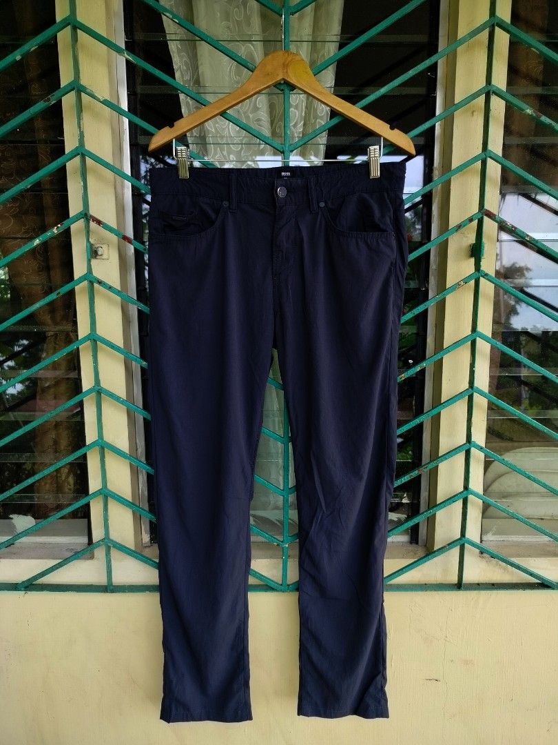 HUGO BOSS Dark Blue Pants Size 31/32 (Category: Trousers) located in Manila. Submitted by virgiliosa38485 (Listing ID 1470000955, Image 1). Description: - Brand: Hugo Boss (Responsible Collection) - Color: Dark blue - Size Waist 32-33 -Length 41.5 -Leg Opening /Hem 7.5 - Details: Branded buttons, custom coin pocket hardware, and contrast branding badge - Closure: Standard waist with zip fly - Condition: Clean fabric texture.