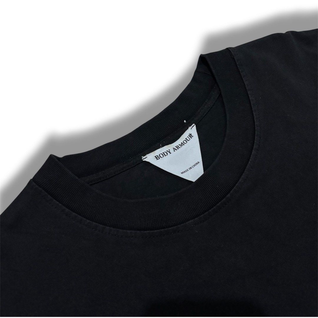 Human Made vibes (Category: Tshirts & Polo Shirts ) located in Quezon City. Submitted by grailph (Listing ID 1470064309, Image 3). Description: - Brand: Body Armour - Color: Black - Dimensions: 24”x 30” - Fit: Standard fit, crew neck, short sleeves - Front Detail: Embroidered red heart on the chest - Back Detail: Large yellow "Burgess Viorica" text with embroidered ducks and grain graphic - Style: Clean streetwear piece with premium embroidery Co