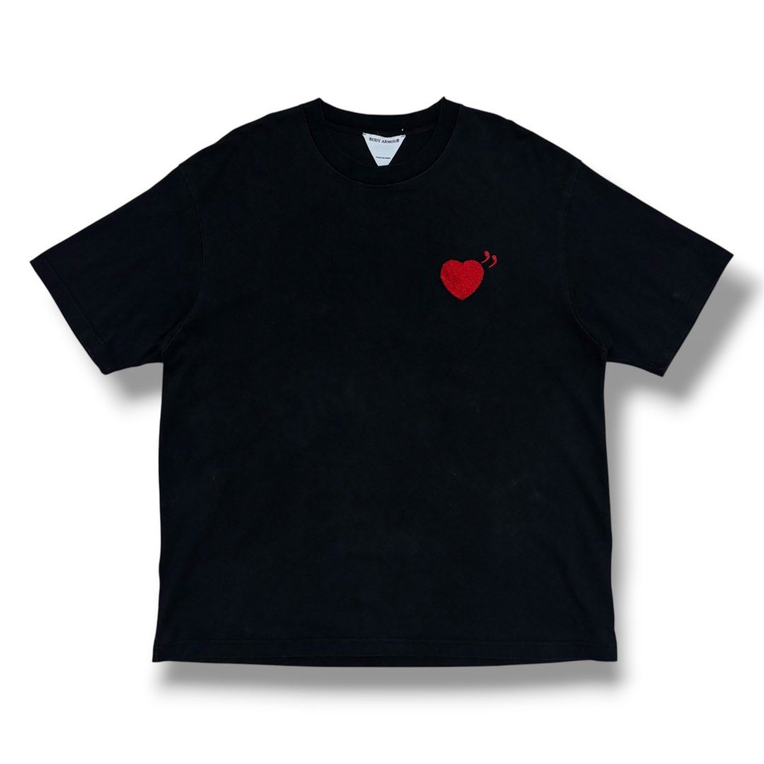 Human Made vibes (Category: Tshirts & Polo Shirts ) located in Quezon City. Submitted by grailph (Listing ID 1470064309, Image 2). Description: - Brand: Body Armour - Color: Black - Dimensions: 24”x 30” - Fit: Standard fit, crew neck, short sleeves - Front Detail: Embroidered red heart on the chest - Back Detail: Large yellow "Burgess Viorica" text with embroidered ducks and grain graphic - Style: Clean streetwear piece with premium embroidery Co
