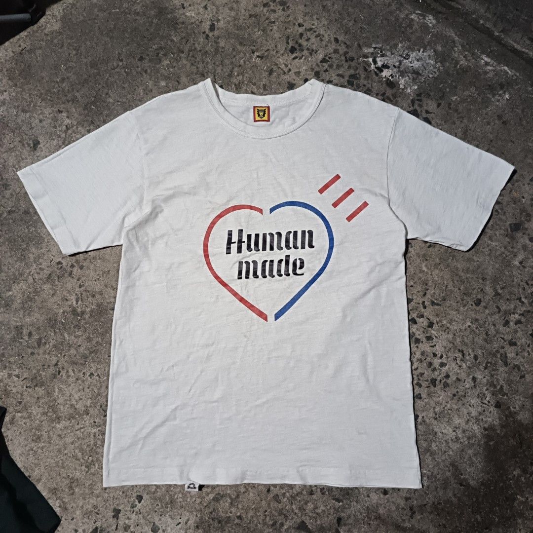 Human Made White Graphic T-Shirt Small (Category: Tshirts & Polo Shirts ) located in Caloocan City. Submitted by gemfinder669 (Listing ID 1470045494, Image 1). Description: - Brand: Human Made - Color: White with iconic heart graphic logo - Size: Small (tag inside) - Material: 100% Cotton - Origin: Made in Japan - Condition: Clean, excellent piece with clear inner collar tags - Style: Classic crew neck and short sleeves.
