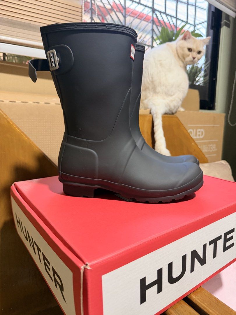 Hunter Original Short Rain Boots Black Adjustable Back (Category: Boots) located in Makati City. Submitted by gllydeclutters1997 (Listing ID 1470040257, Image 3). Description: - Brand: Hunter - Style: Short rain boots with adjustable side buckle - Color: Classic matte black - Details: Signature red box logo on front - Inclusion: Original red Hunter shoebox - Condition: Great for rainy days or outdoor events.