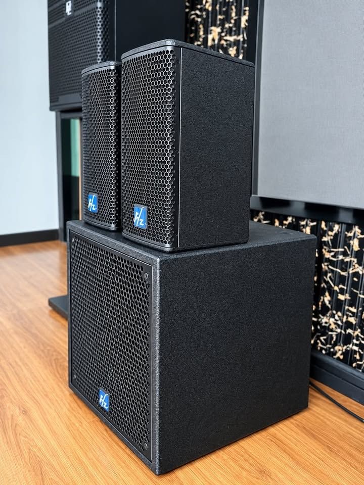 HZ Sound 2.1 Speaker System with Subwoofer (Category: Soundbars, Speakers & Amplifiers) located in Paranaque City. Submitted by digitalconcept.corp (Listing ID 1469961802, Image 2). Description: - Complete audio setup: 2 satellite speakers and 1 matching subwoofer - Sleek black textured cabinets with stylish hexagonal metal grilles - Distinctive blue HZ logo badges on each unit - Sturdy, heavy-duty build ideal for home entertainment - Clean condi