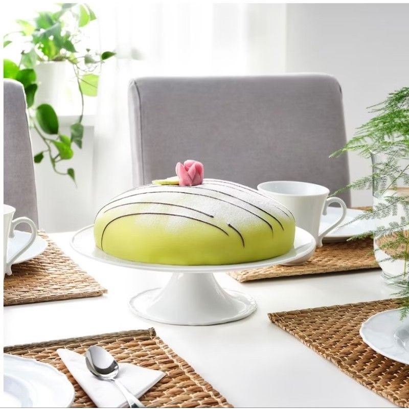 IKEA UPPLAGA Cake Stand with Base 29 cm (Category: Bakeware) located in Makati City. Submitted by goldenbird.001 (Listing ID 1470022313, Image 3). Description: - Authentic IKEA UPPLAGA cake stand - Diameter: 29 cm - Material: Premium white ceramic with a lovely scalloped edge base - Designer: Ebba Strandmark - Condition: Brand new in original packaging/box with barcode - Perfect for displaying cakes, pastries, and desserts for any occasion.