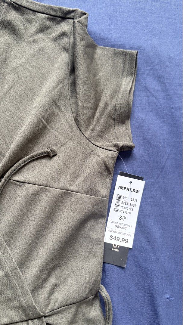 IMPRESS! Sage Green Wrap Dress Size S (Category: Dresses) located in Manila. Submitted by livebear-e9f3 (Listing ID 1469966393, Image 2). Description: - Brand: IMPRESS! - Style: Short-sleeve wrap dress with V-neckline and tie waist - Color: Sage green - Size: Small - Condition: Brand new with tags (BNWT), never worn - Material/Origin: Made in Bangladesh - Price tag: $49.99 (Compare at $85.00) - Price is negotiable.