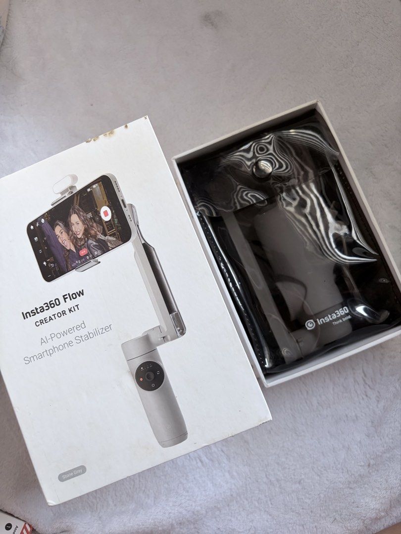 Insta360 Flow Gimbal Stabilizer (Category: Other Mobile & Gadget Accessories) located in Taguig. Submitted by whatthesigmarizz (Listing ID 1470044732, Image 3). Description: In excellent condition with no flaws. Well-kept and fully presentable. Inclusions: * Insta360 Flow gimbal stabilizer * Original box * Magnetic phone clamp * USB charging cable * Additional cable/accessories shown in the photos * Built-in tripod * Manuals and accessory packagi