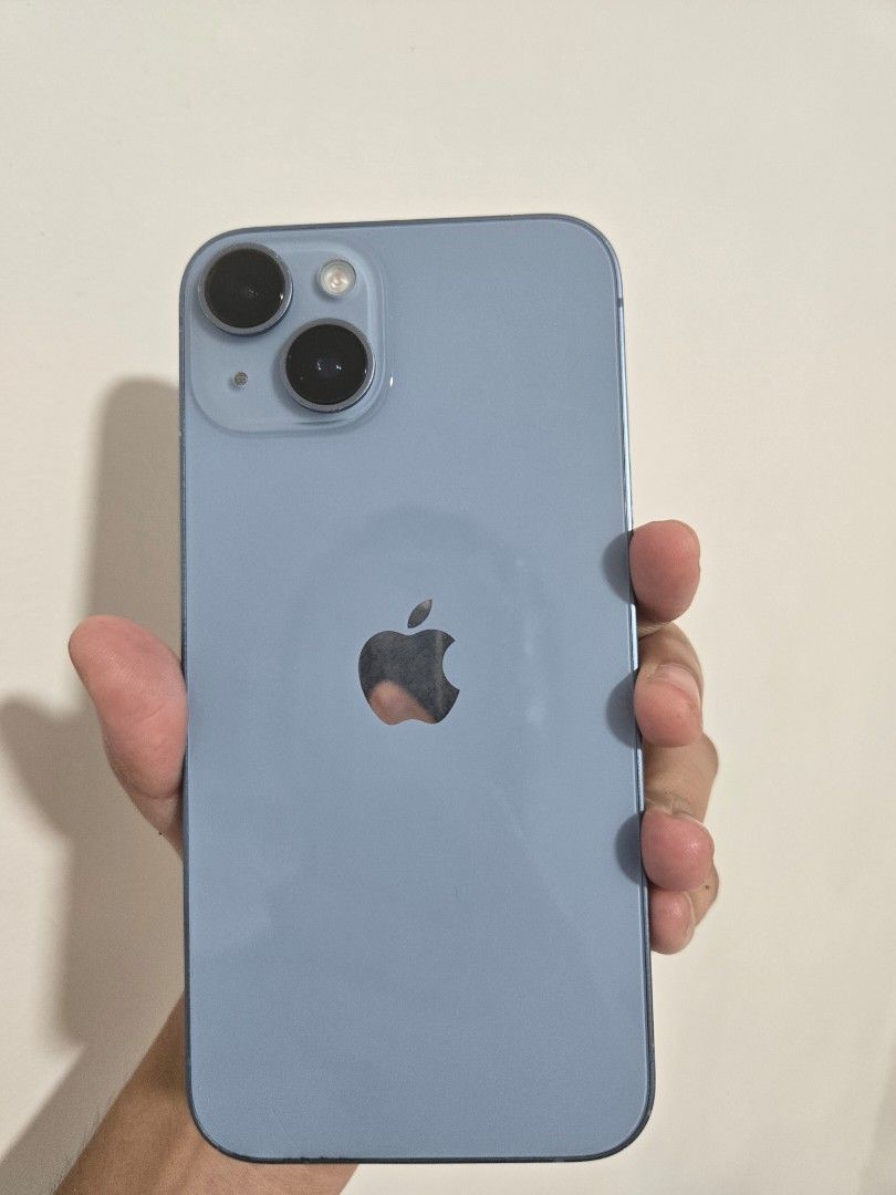 iPhone 14 (Category: iPhone 14 Series) located in Pasig City. Submitted by nhin04 (Listing ID 1470019295, Image 1). Description: - Model: iPhone 14 - Storage: 128GB - Color: Blue - Condition: minimal scratches and may dent sa gilid pero maliit lang siya and di naman nakaka affect sa performance ng phone. - Unit only - Meetup locations: Robinsons Galleria, SM Megamall, SM Molino, Ayala Malls Vermosa.