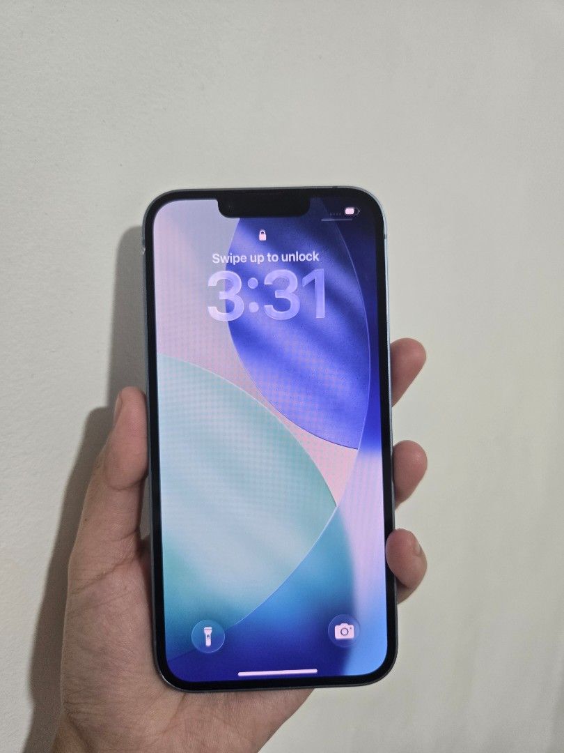 iPhone 14 (Category: iPhone 14 Series) located in Pasig City. Submitted by nhin04 (Listing ID 1470019295, Image 2). Description: - Model: iPhone 14 - Storage: 128GB - Color: Blue - Condition: minimal scratches and may dent sa gilid pero maliit lang siya and di naman nakaka affect sa performance ng phone. - Unit only - Meetup locations: Robinsons Galleria, SM Megamall, SM Molino, Ayala Malls Vermosa.