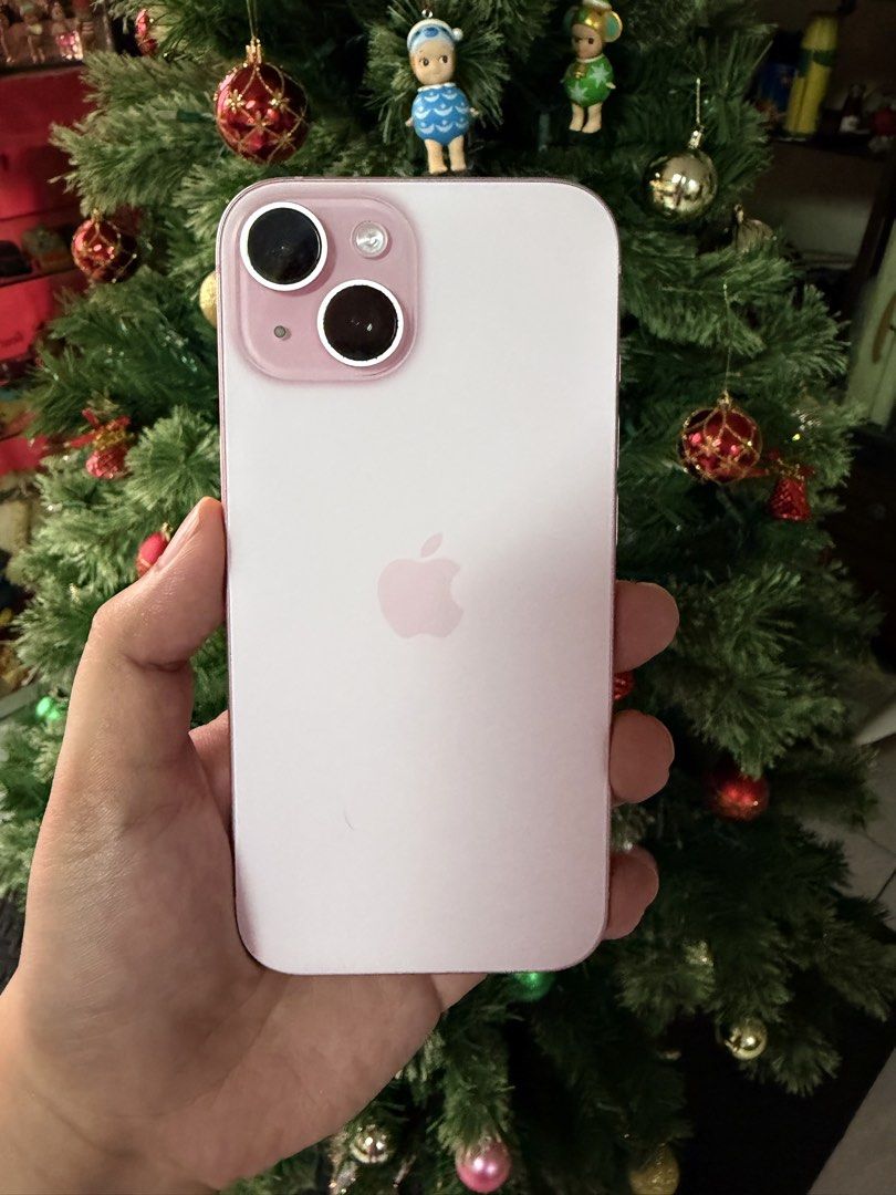 Iphone 15 (Category: iPhone 15 Series) located in Agdangan. Submitted by maomao03302 (Listing ID 1470041833, Image 3). Description: - Model: iPhone 15 - Storage: 128GB - Color: Pink - Condition: Excellent, well-maintained - Inclusions: Original box, charger, and SIM ejector pin - Details are all in the uploaded pics. Can send other pictures upon request - Bought in powermac Lipa, Batangas - Can also give my phone cases and 1 tempered glass - Pric