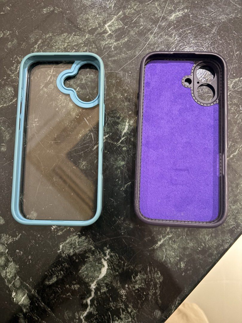 Iphone 16 case （分類：手機套及手機殻）位於 Hong Kong。 由 branded_guy 提交（商品編號 1470138696，圖片 2）。簡介： Clearing out extra phone cases. One purple case with built-in MagSafe ring that folds out into a phone stand. Soft purple microfiber lining inside. Second case is a translucent clear back with a blue bumper frame and unique camera cutout design. Both fit standard smartphone dimensions. Grab both together.。